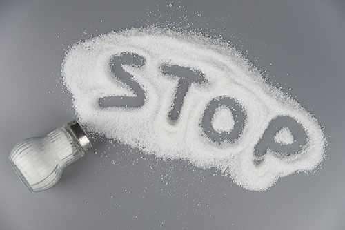 "Stop" written in a pile of salt