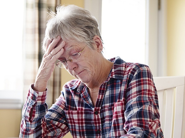 Be honest about the emotional toll of incontinence Image of a worried elderly woman