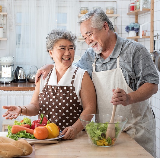Senior couple having fun in the kitchen Senior couple having fun in the kitchen
