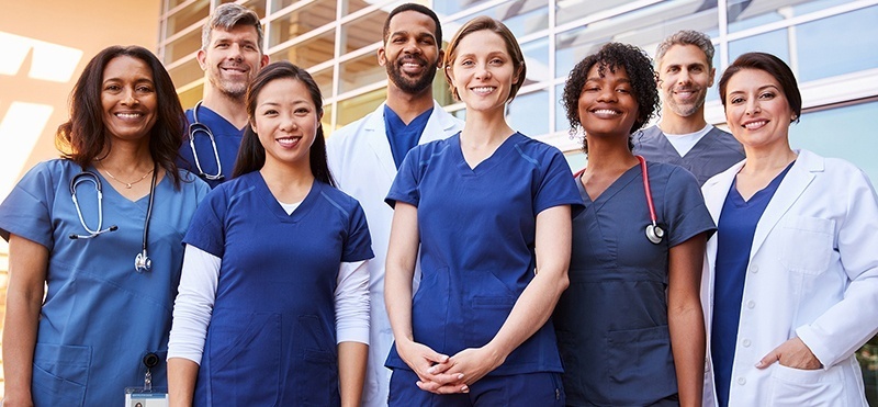 group a smiling nurses and doctors