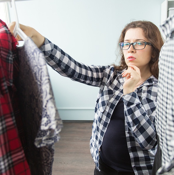 woman picking out clothes woman picking out clothes
