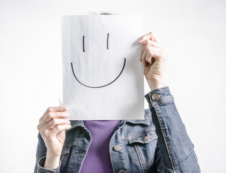 false-cheerfullness putting on a happy face