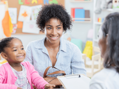 let others in parent and child talking to a teacher about diabetes