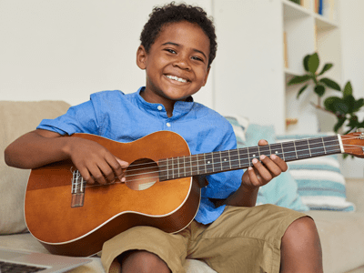 find that superpower talent child playing guitar