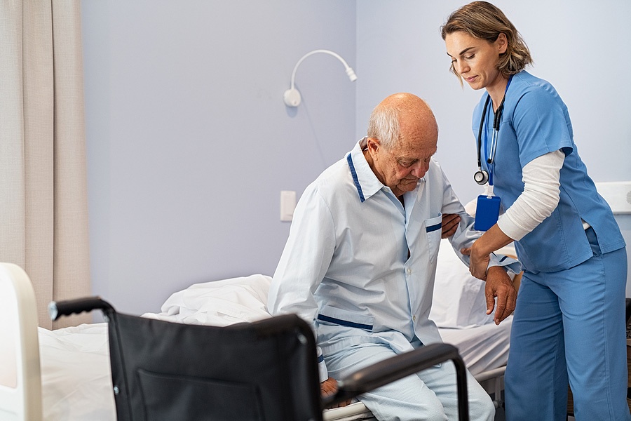 nurse helping senior man