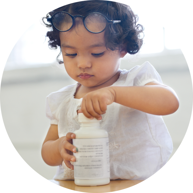 keep your pills far away from children Child with an adult's medicine bottle