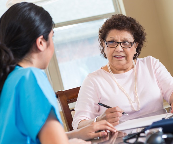 patient taking notes at a doctor appintment