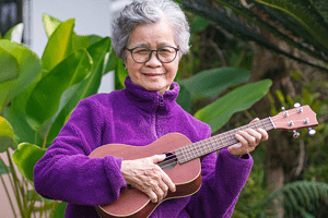 woman playing ukelele