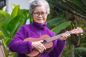 Learn something new. woman playing ukelele