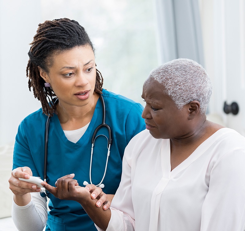 nurse checking a woman with diabetes distress