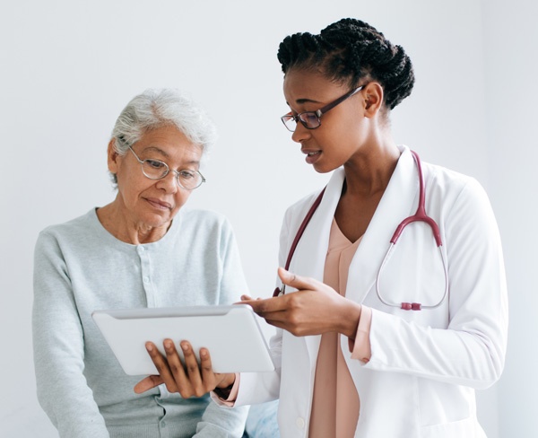 doctor talking to woman about catheters